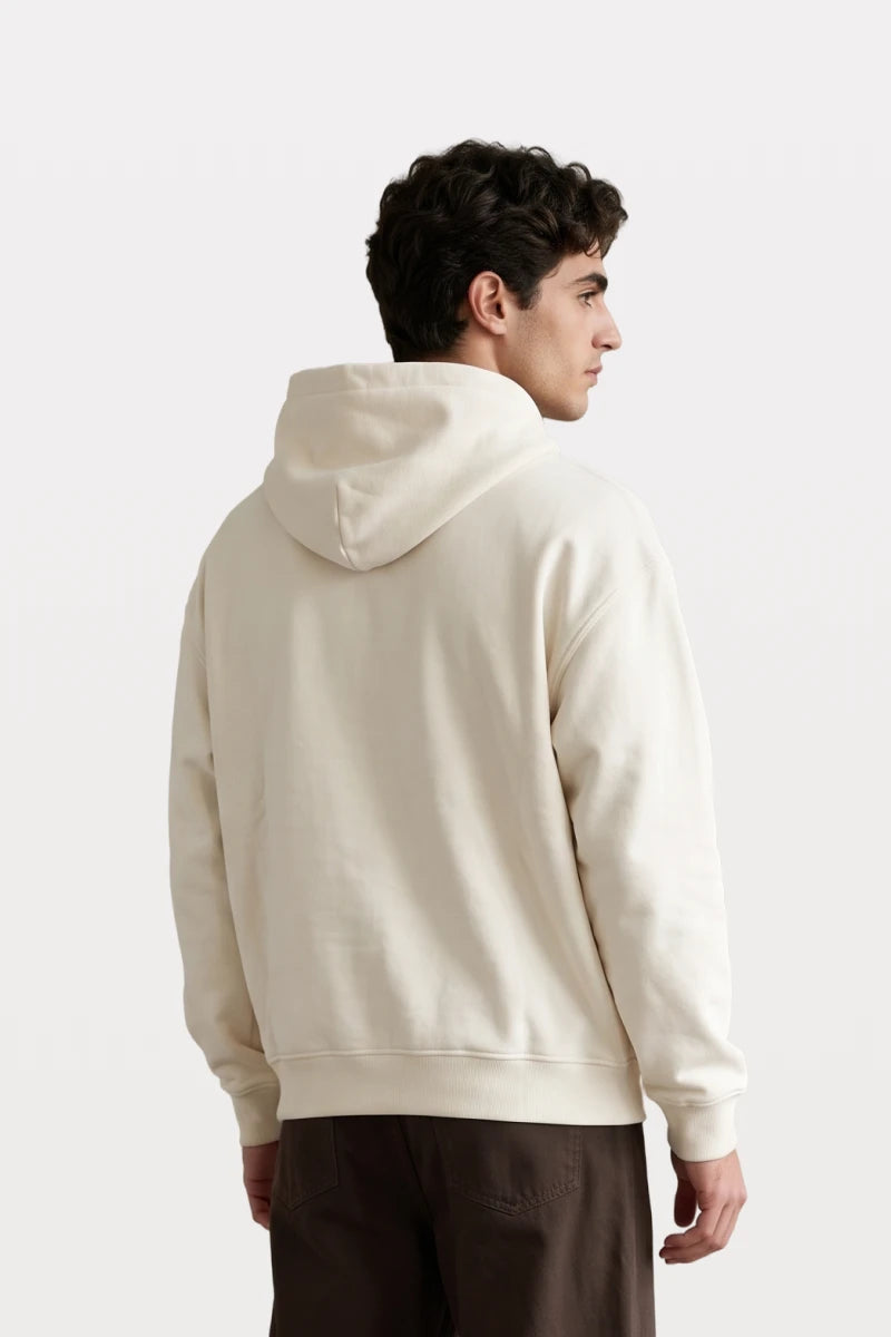 RAQI Essential Pullover Hoodie in creamy light beige, featuring a heavyweight fabric and back view on a male model.