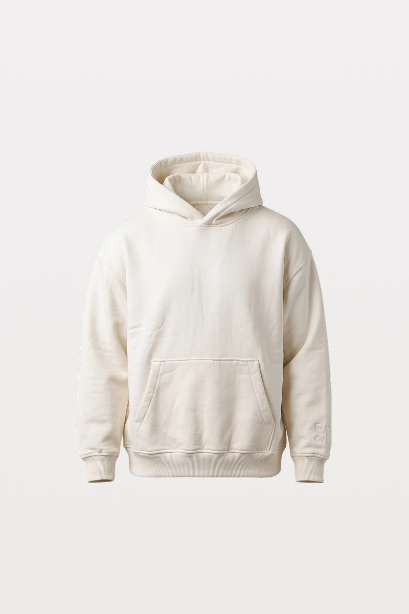 RAQI creamy light beige heavyweight pullover hoodie with a spacious hood, kangaroo pocket, and ribbed cuffs.